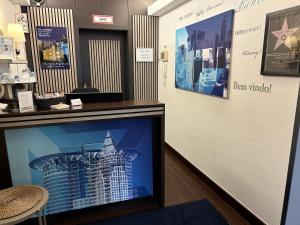 a display case in a store with a picture of a building at Villa Hotel Frankfurt by MZ HotelCollection in Frankfurt/Main