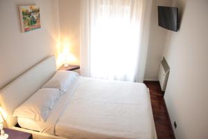 Postel nebo postele na pokoji v ubytování Lo Scalino