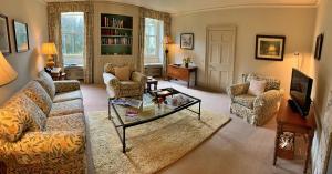 a living room with a couch and a coffee table at Finest Retreats - Ingleby Manor - South Front in Great Ayton