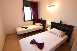 Posteľ alebo postele v izbe v ubytovaní Apartamento con piscina y vistas al mar ref 154