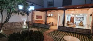 a lobby of a house with a table and a tree at Casa 59 - Guest House in Bucaramanga