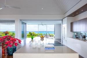 an open kitchen with a view of the ocean at Breathtaking Oceanfront Villa with Views and Private Pool in Providenciales