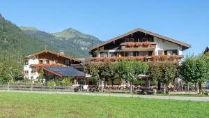 a large building with plants on the side of it at Birgsau in Oberstdorf