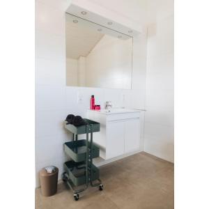 a bathroom with a sink and a mirror at SeeHus - Nordhorn in Nordhorn