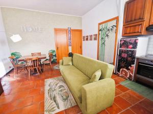 a living room with a couch and a table at OSTIA HOME in Lido di Ostia