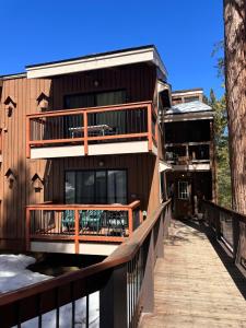 a building with a wooden walkway in front of it at Yosemite Condominium Loft unit -B202 in Yosemite West