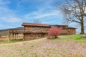 a house on a hill with a tree at Pet-Friendly Onia Vacation Rental with Private Deck! in Onia