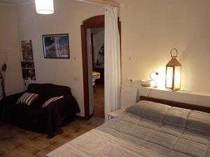 Postel nebo postele na pokoji v ubytování La Finestra sull'Etna