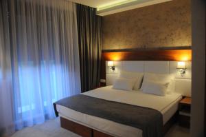 Postel nebo postele na pokoji v ubytování Hotel Porto In