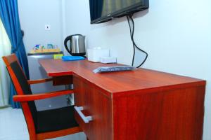 Una televisión o centro de entretenimiento en Vovole Luxury Homes