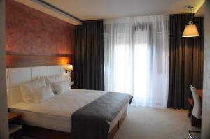 Postel nebo postele na pokoji v ubytování Hotel Porto In