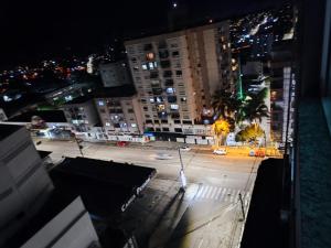 a view of a city street at night at Loft Central in Passo Fundo