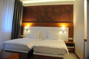 Postel nebo postele na pokoji v ubytování Hotel Porto In
