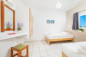 Posteľ alebo postele v izbe v ubytovaní Mylos Apartments Anissaras