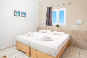 Posteľ alebo postele v izbe v ubytovaní Mylos Apartments Anissaras