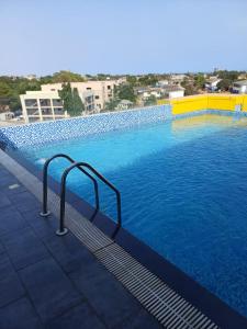 a large swimming pool with blue water at The Edge in Accra