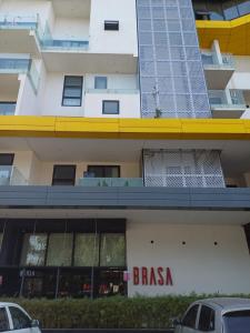 a building with a brasas sign on the side of it at The Edge in Accra