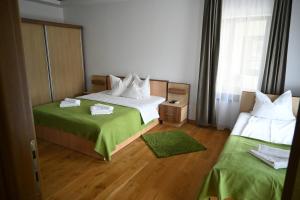 Postel nebo postele na pokoji v ubytování Egreta By Hoxton