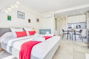 Ένα ή περισσότερα κρεβάτια σε δωμάτιο στο Santa Cruz Alicante Apartamentos