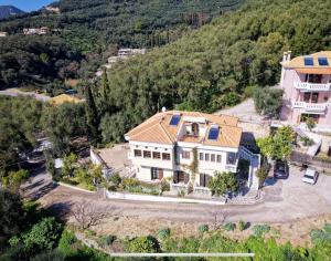 an aerial view of a large white house at Villa Renata & Magic Suite in Parga