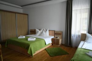Postel nebo postele na pokoji v ubytování Egreta By Hoxton