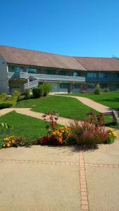 a large building with a pathway in front of it at Hotel Campanile Besançon Nord Ecole Valentin in Besançon