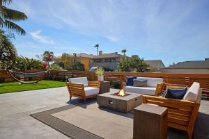 a patio with couches and a fire pit at Family Beach house in Carlsbad