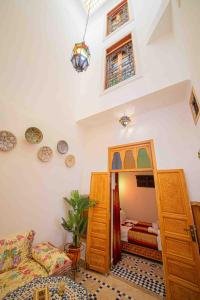 a bedroom with a bunk bed and a mirror at Dar houda in Fès