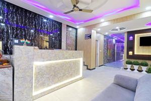 a lobby with a bar with purple lights at Hotel Qubic Stay Near Delhi Airport in New Delhi