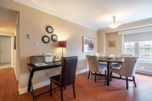 a dining room with a table and chairs at Lovely Waterfront Apt #807 with AC in Halifax