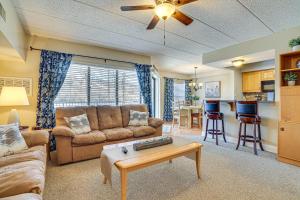 a living room with a couch and a table at Lake Harmony Condo with Big Boulder Lake Views in Lake Harmony