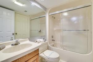 a bathroom with a sink and a shower and a toilet at Lake Harmony Condo with Big Boulder Lake Views in Lake Harmony