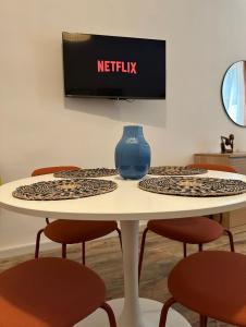 TV o dispositivi per l'intrattenimento presso Etna charme apartment