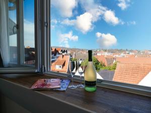 a bottle of wine sitting on a window sill at Boutique Hotel in Bad Salzuflen