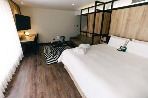 Postel nebo postele na pokoji v ubytování BTH Hotel Lima Golf