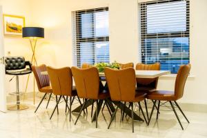 a dining room with a table and chairs at Newtown House in Newry