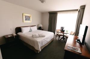 Postel nebo postele na pokoji v ubytování BTH Hotel Lima Golf