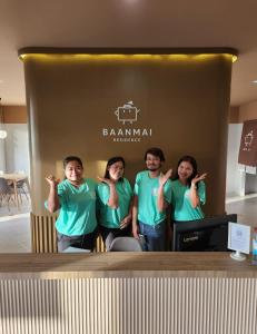 a group of people standing in front of a booth at Baanmai Residence in Ban Krabi Yai
