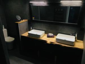 a bathroom with two sinks on a wooden counter at Maison Surf & Nature à Hendaye in Hendaye +6 photos