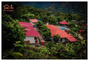 an aerial view of a house with red roofs at SONCCO LODGE-RESTAURANT in Quillabamba