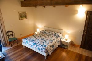 Letto o letti in una camera di Agriturismo Le Tre Rose - Cantina Zanello