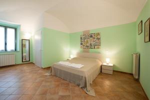 Letto o letti in una camera di Agriturismo Le Tre Rose - Cantina Zanello