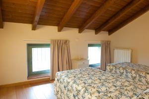 Letto o letti in una camera di Agriturismo Le Tre Rose - Cantina Zanello