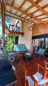a living room with a laptop on a table at Fincas Panaca Herreria 26 in Quimbaya +29 photos