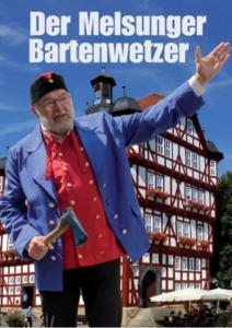 an older man is standing in front of a building at Hotel Bartenwetzer vormals Ellenberger in Melsungen