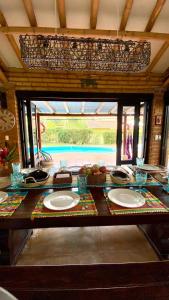 a dining room table with plates of food on it at Fincas Panaca Herreria 26 in Quimbaya