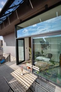 a patio with sliding glass doors and a table at Erkan Alek Heritage Hotel in Gyumri