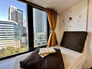 Postel nebo postele na pokoji v ubytování Makati Staycation by Marco - SMDC Lush