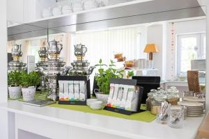 a counter with dishes and other items on it at Landhaus Gretl by S4Y in Krumpendorf am Wörthersee