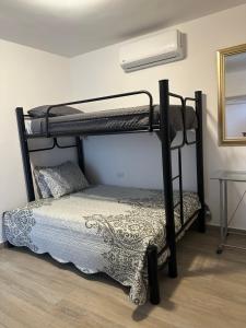 Ένα ή περισσότερα κρεβάτια σε δωμάτιο στο Treviso San Marino